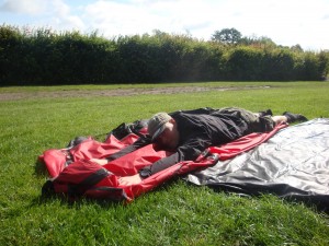 packing a tent in the wind